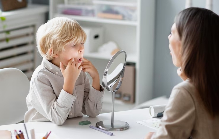 woman-doing-speech-therapy-with-little-boy-her-clinic_23-2149110243.jpg