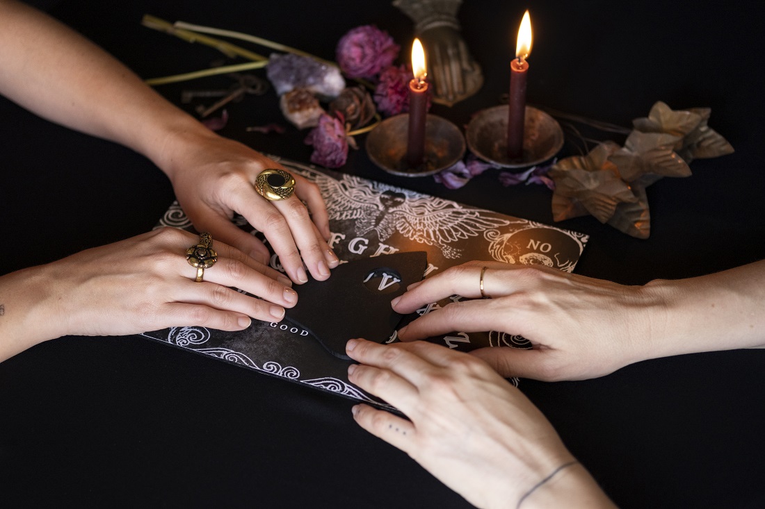 high-angle-people-using-old-ouija-board.jpg