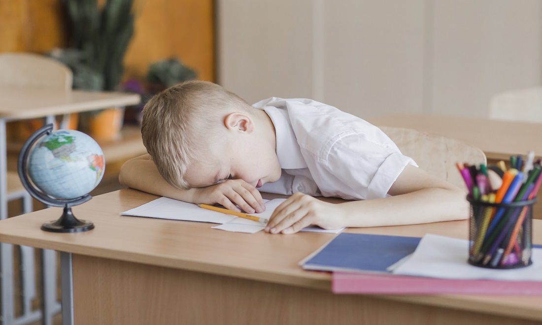 little-pupil-laying-table-classroom.jpg